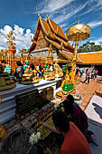 Chiang Mai - Wat Phra That Doi Suthep. The innercourtyard of the temple is filled with Buddha statues and other religious paraphenalia. 